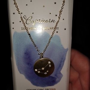 Gold necklace with Capricorn symbol